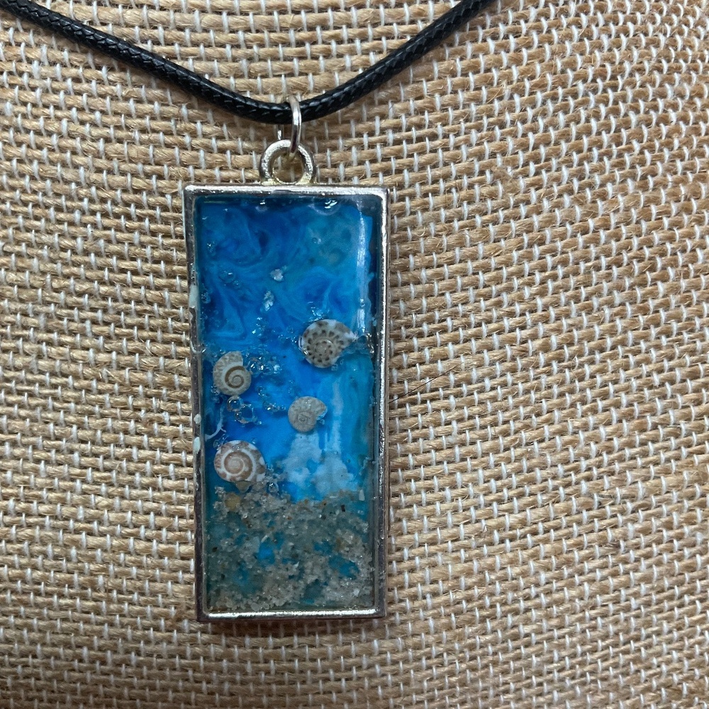 Homemade resin beach scene necklace